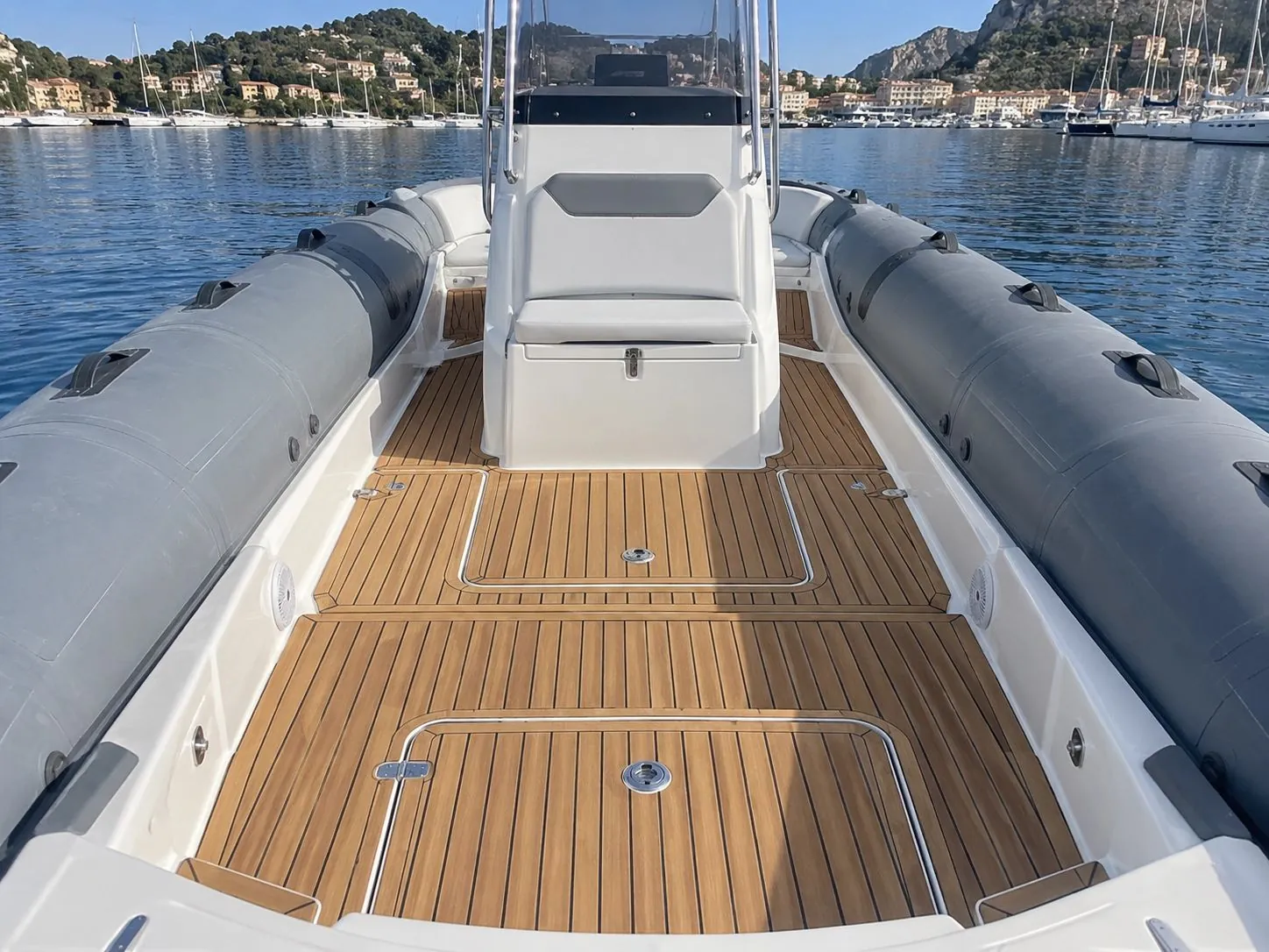 Before: Walking surfaces, side decks and boarding platforms of the inflatable boat, original flooring